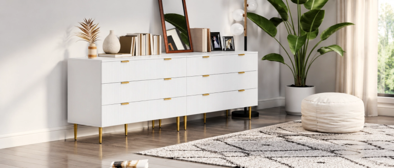 White fluted dresser with gold legs in bright bedroom